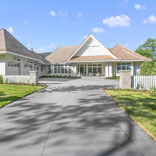 Two small pillars and picket fence give boundary and entrance to guests