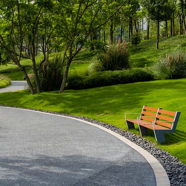 tranquil urban park with glass meadows and footpath. city environment concept.