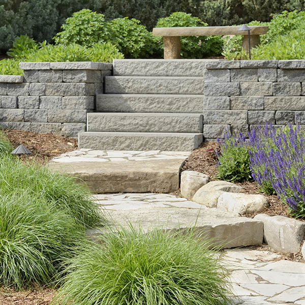 A professional landscaping job with stone path and stone steps.