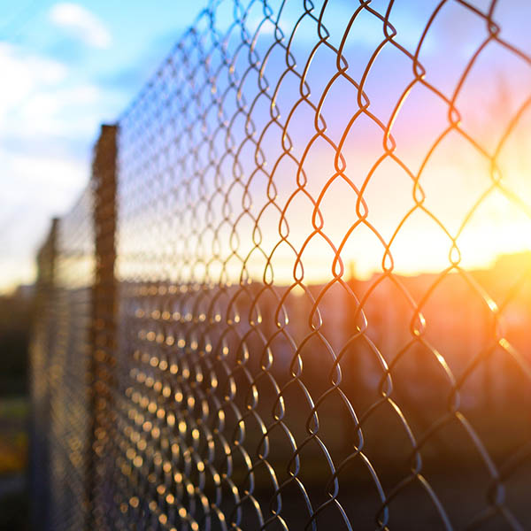 fencing with metal grid in perspective, background CARSON CITY, NV